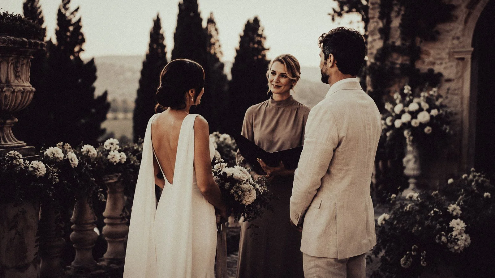 Symbolic wedding ceremony in Italy, intimate outdoor setting at golden hour