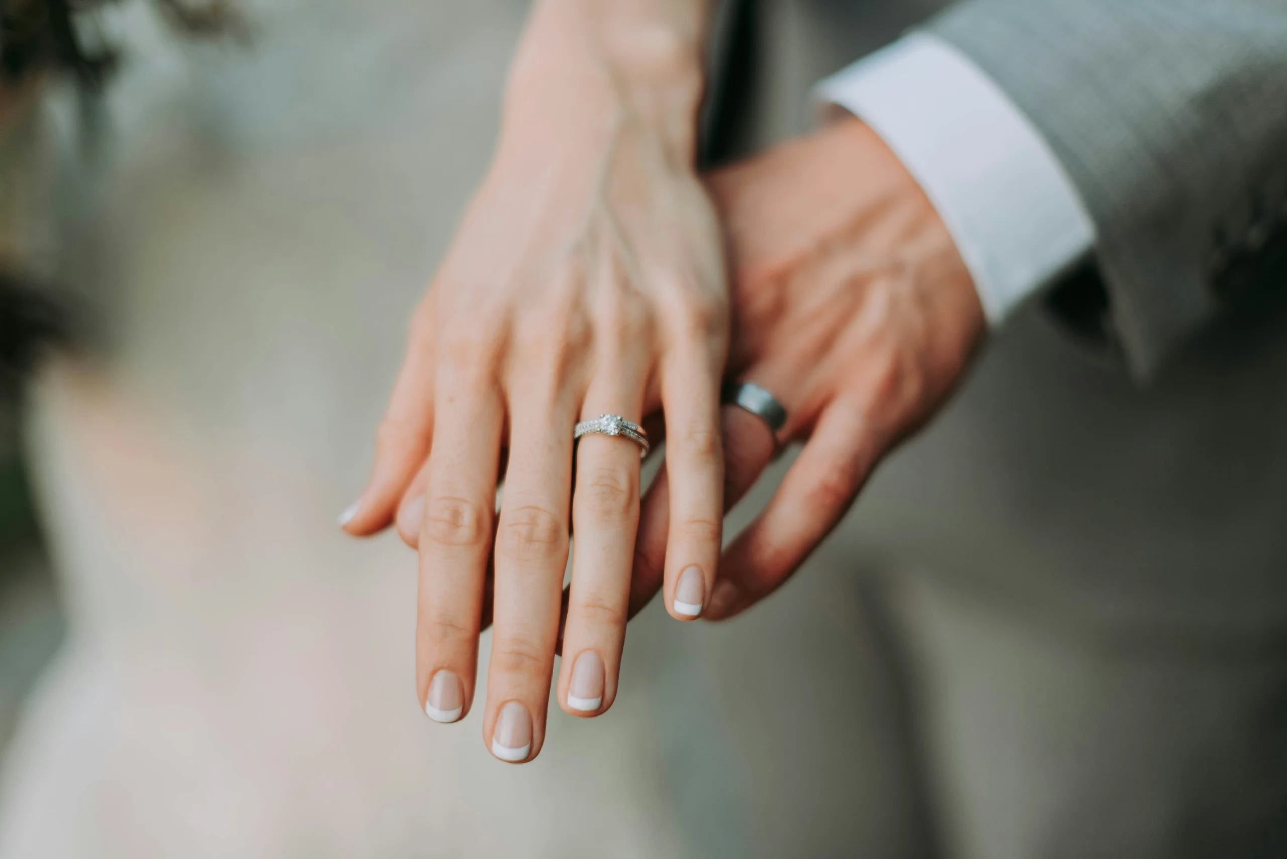 Bride and groom exchanging rings at an intimate wedding ceremony in Italy.