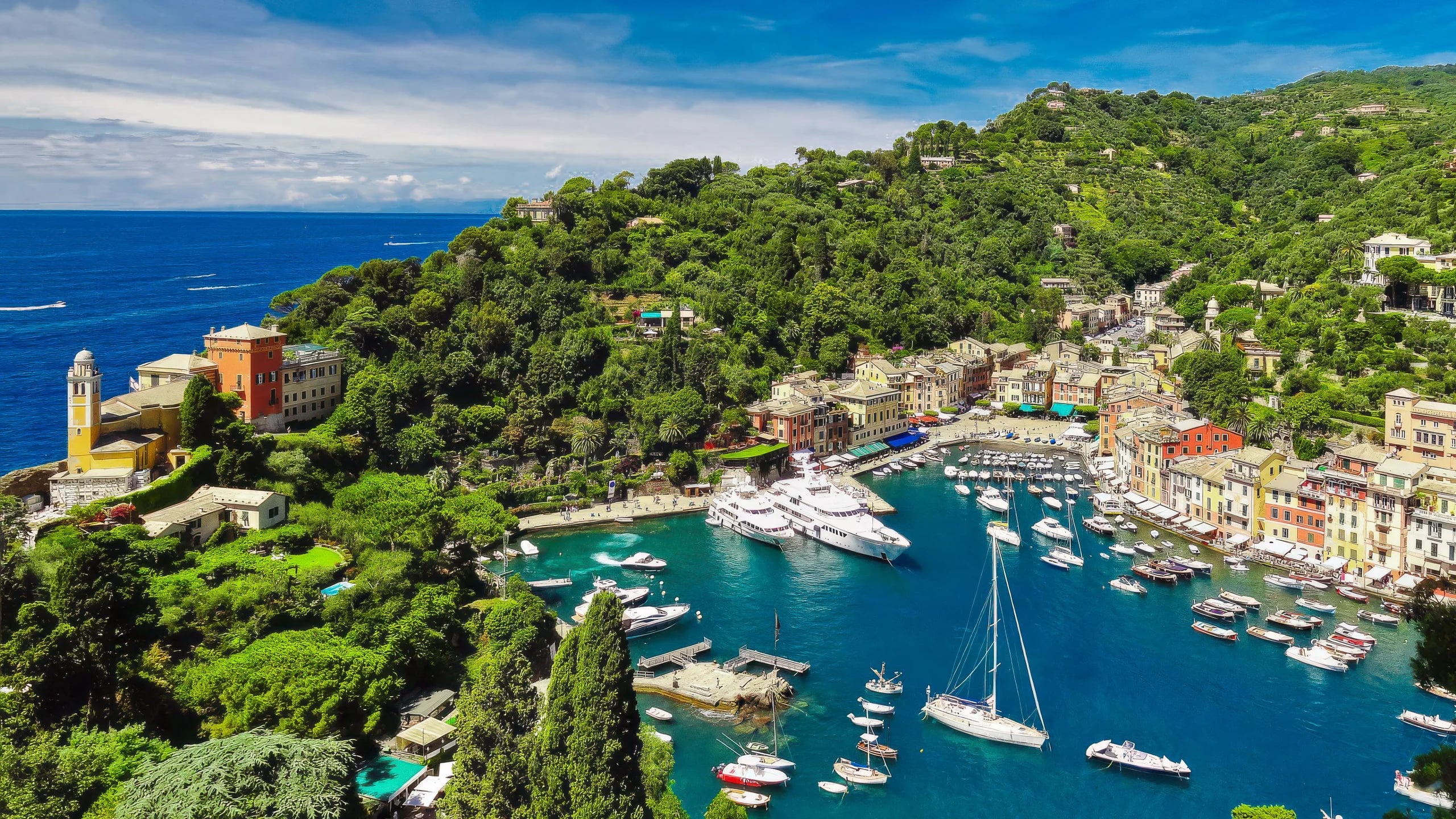 Portofino harbor aerial view — turquoise bay, pastel facades and wooded promontory, Italian Riviera destination wedding
